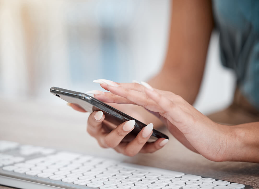 closeup-of-hands-of-businesswoman-scrolling-online-2025-04-06-07-50-24-utc (1)